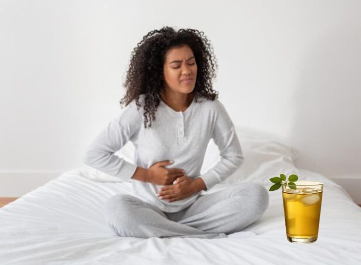 A woman battling with moringa tea side effects