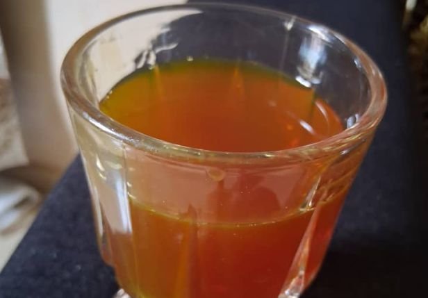 A glass of tamarind root tea